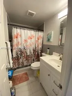 a bathroom with a sink and a shower