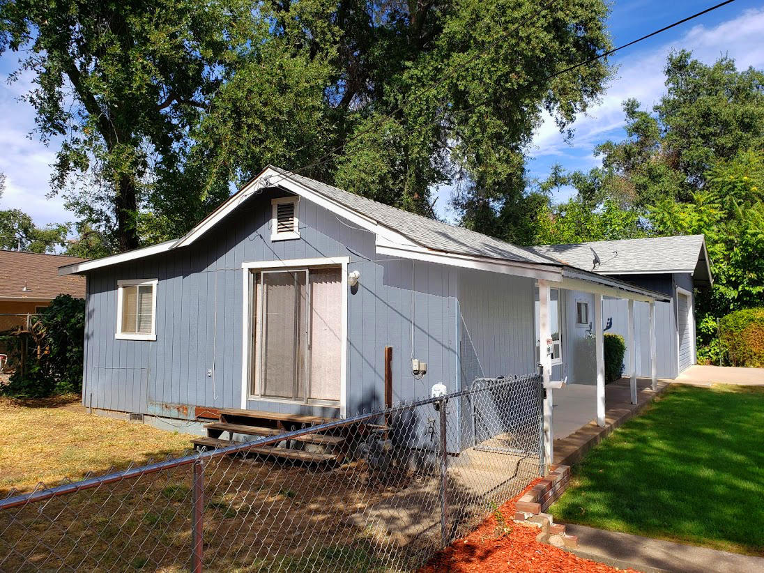2771 Henderson Road Redding, CA 96002 - Photo 3 of 7 a front view of a house with a yard