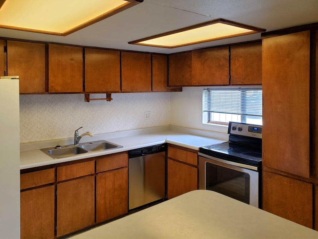 2771 Henderson Road Redding, CA 96002 - Photo 4 of 7 a kitchen with a sink cabinets and appliances