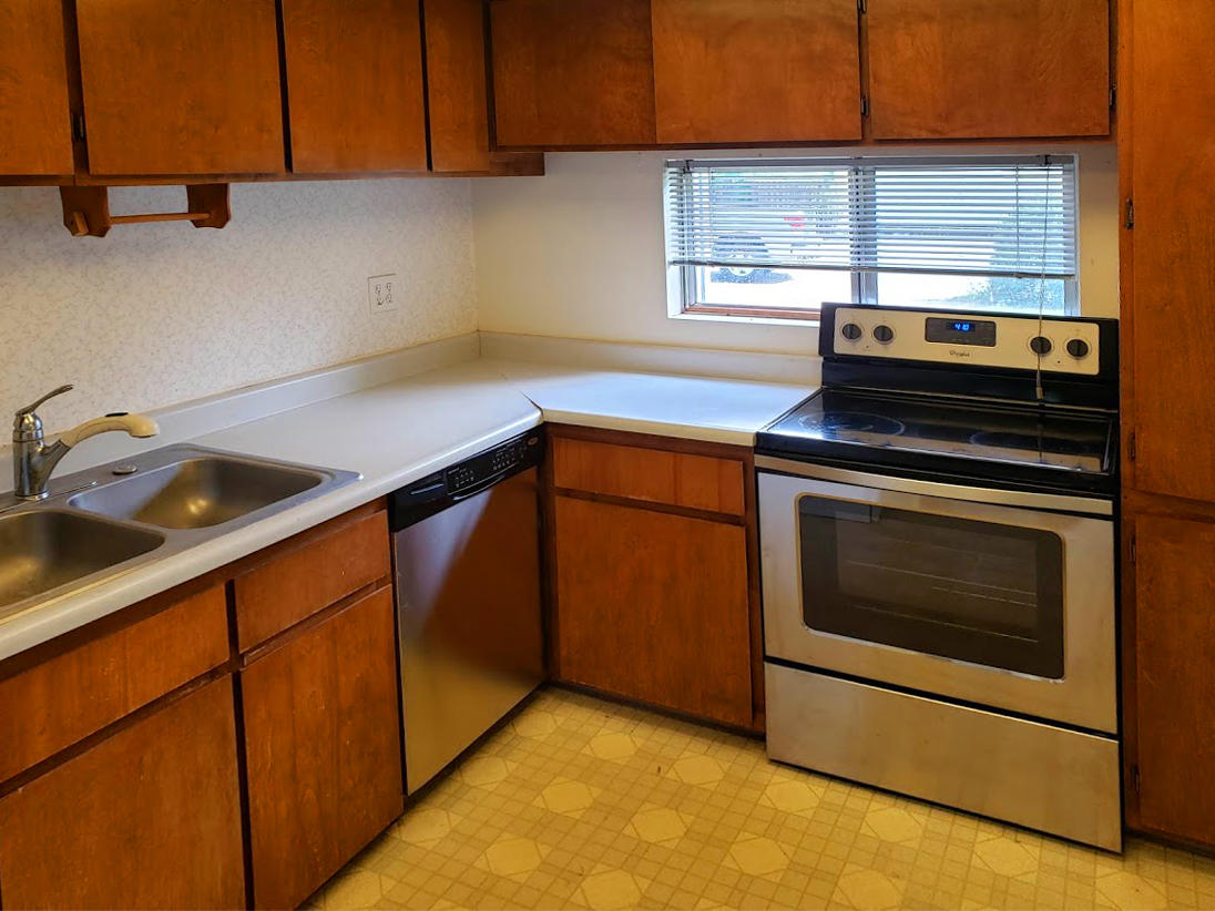 2771 Henderson Road Redding, CA 96002 - Photo 7 of 7 a kitchen with a stove and a microwave