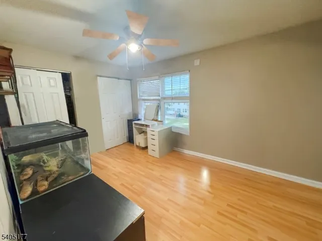 a bedroom with a bed and a table in it