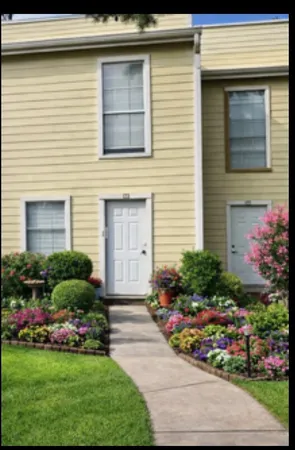 a view of a swimming pool with an outdoor space and seating area