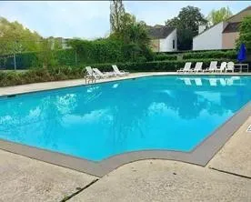 a view of backyard with a table and chairs