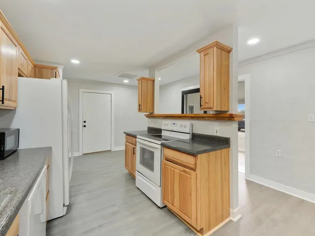 a kitchen with a stove and a microwave