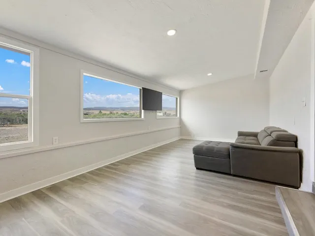 a living room with couch and a window