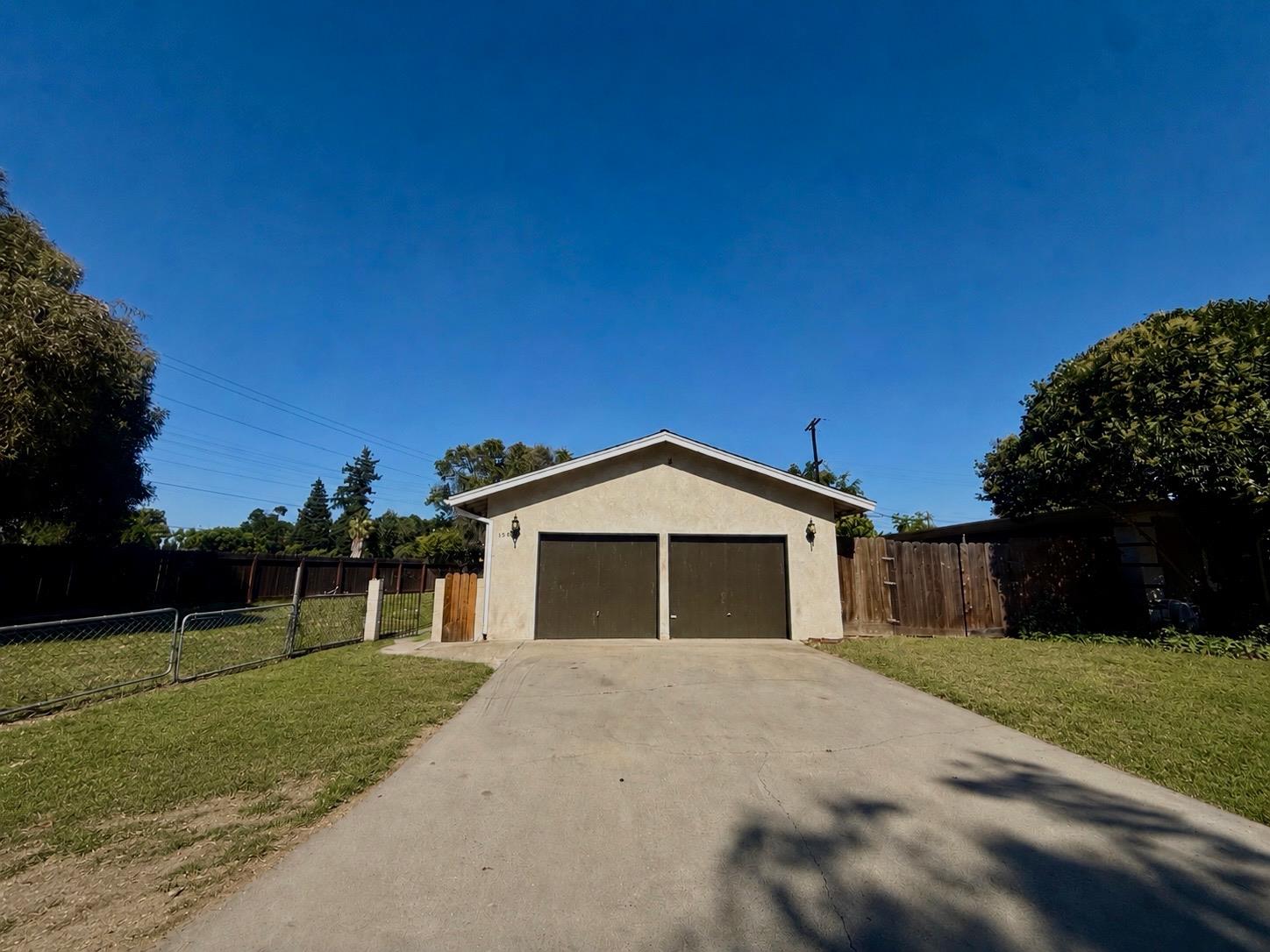 1636 Cameo Way Modesto, CA 95350 - Photo 2 of 29 a front view of a house with a yard