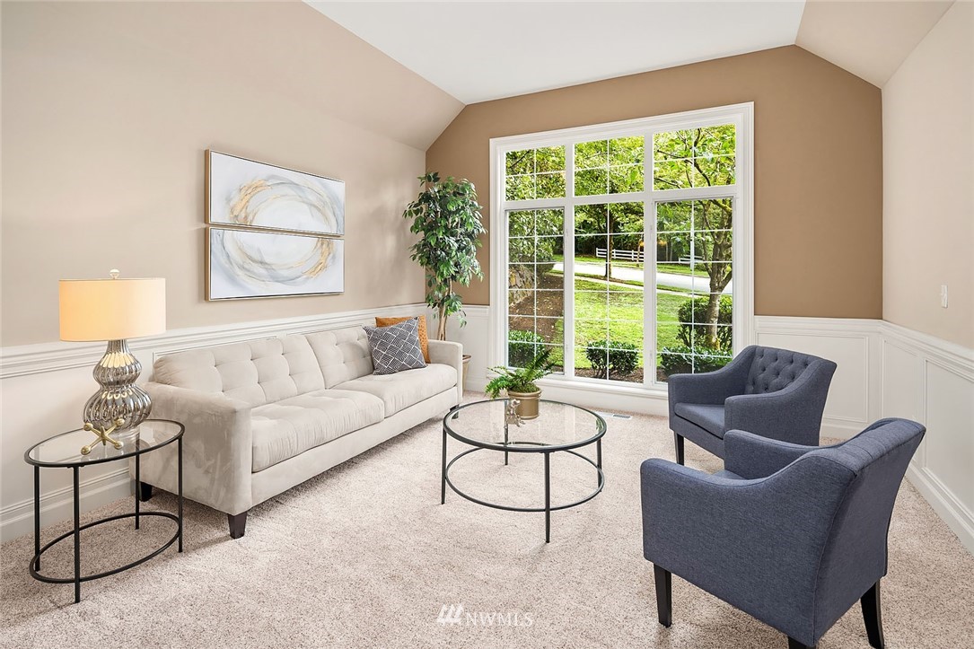 3002 204th Street Southeast Bothell, WA 98021 - Photo 4 of 27 a living room with furniture and a large window