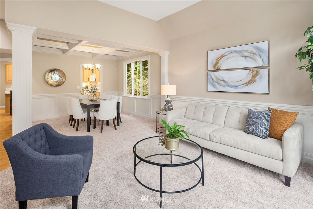 3002 204th Street Southeast Bothell, WA 98021 - Photo 5 of 27 a living room with furniture a clock and a window