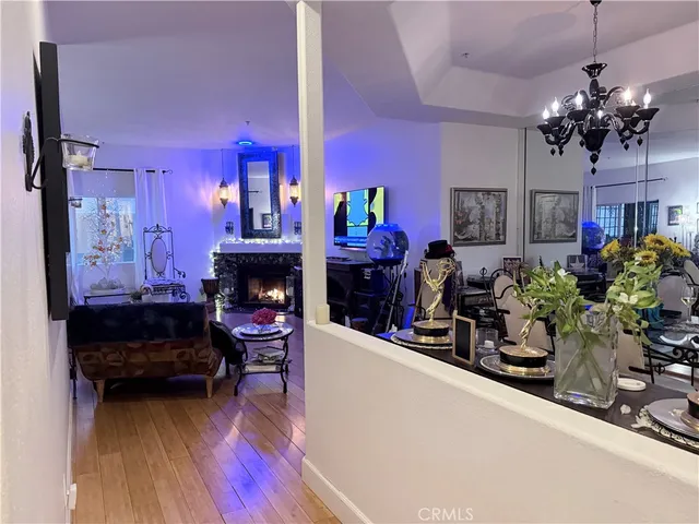 a living room with lots of furniture and a chandelier