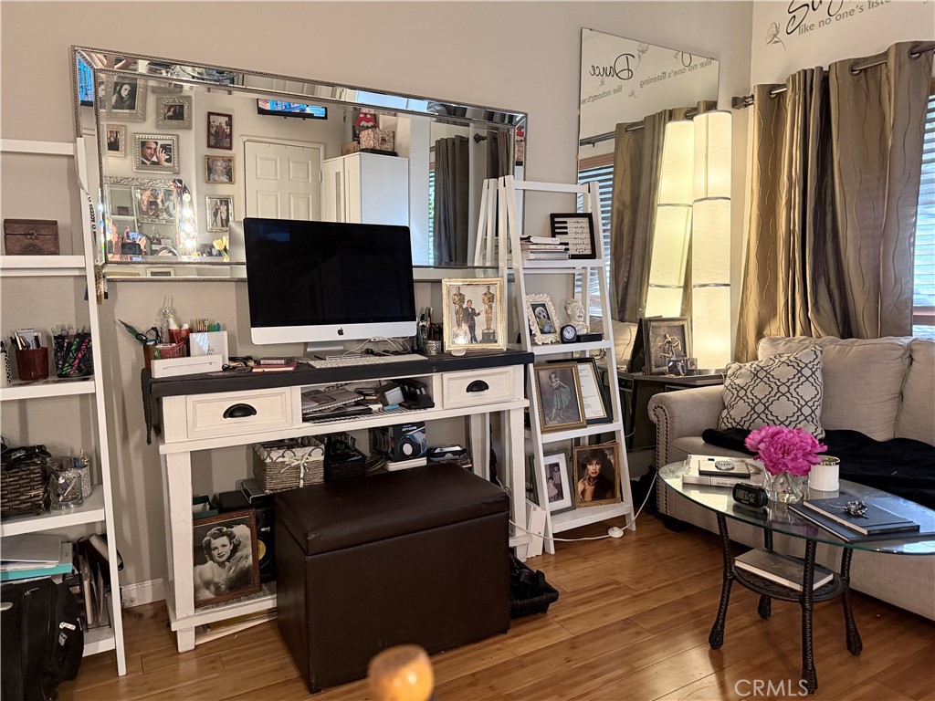 10626 Valley Spring Lane, Unit 103 Toluca Lake, CA 91602 - Photo 11 of 13 a room with furniture and a flat screen tv