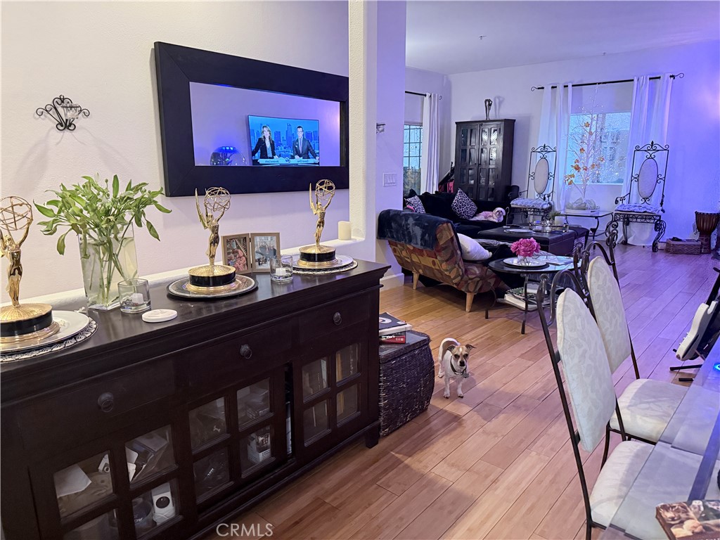 10626 Valley Spring Lane, Unit 103 Toluca Lake, CA 91602 - Photo 12 of 13 a living room with furniture and a flat screen tv