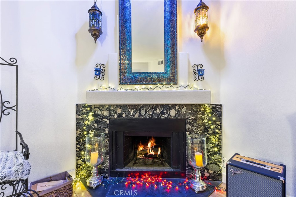 10626 Valley Spring Lane, Unit 103 Toluca Lake, CA 91602 - Photo 23 of 44 a living room with furniture and a fireplace