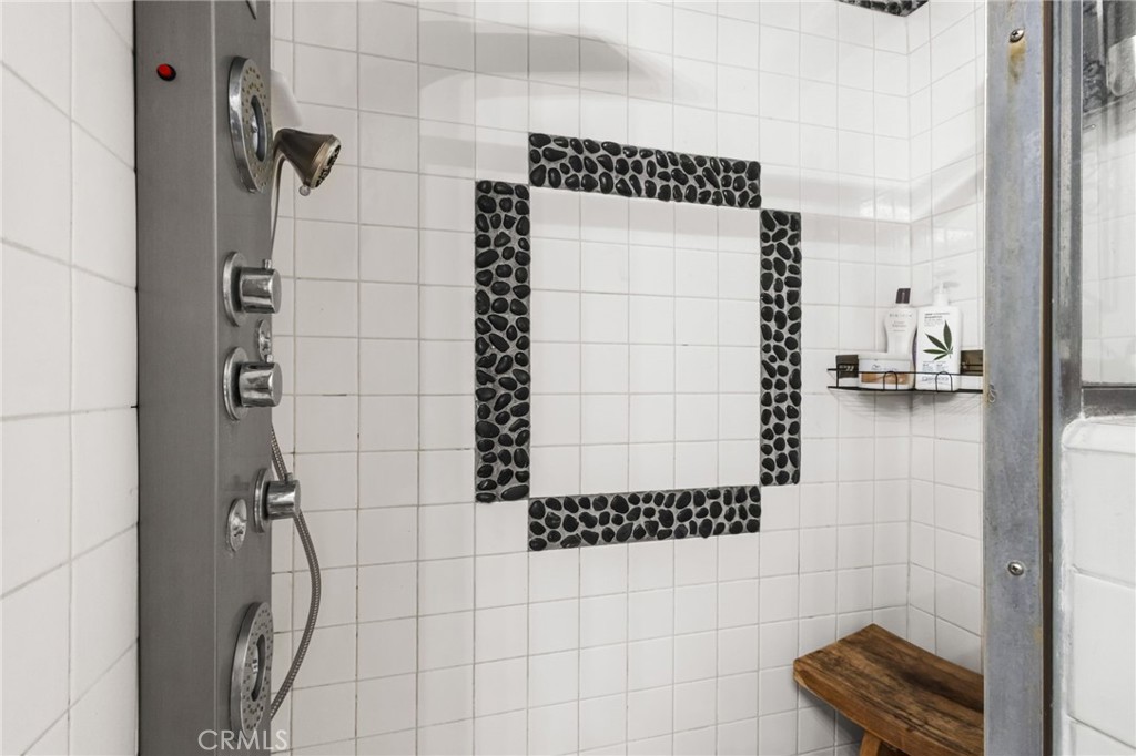 10626 Valley Spring Lane, Unit 103 Toluca Lake, CA 91602 - Photo 30 of 44 a bathroom with a shower