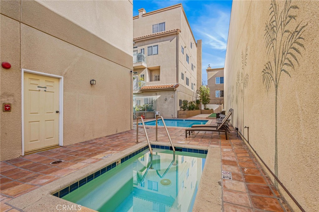 10626 Valley Spring Lane, Unit 103 Toluca Lake, CA 91602 - Photo 38 of 44 a view of swimming pool with outdoor seating