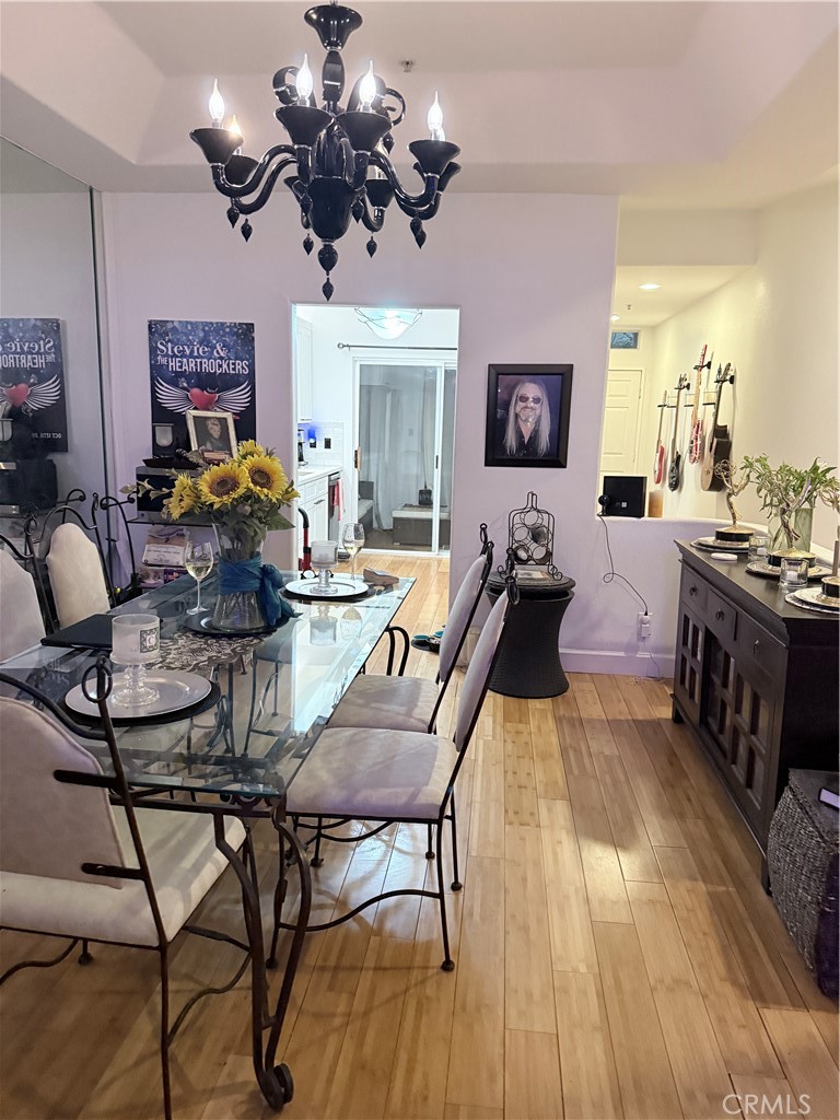 10626 Valley Spring Lane, Unit 103 Toluca Lake, CA 91602 - Photo 4 of 13 a living room with fireplace furniture and a wooden floor