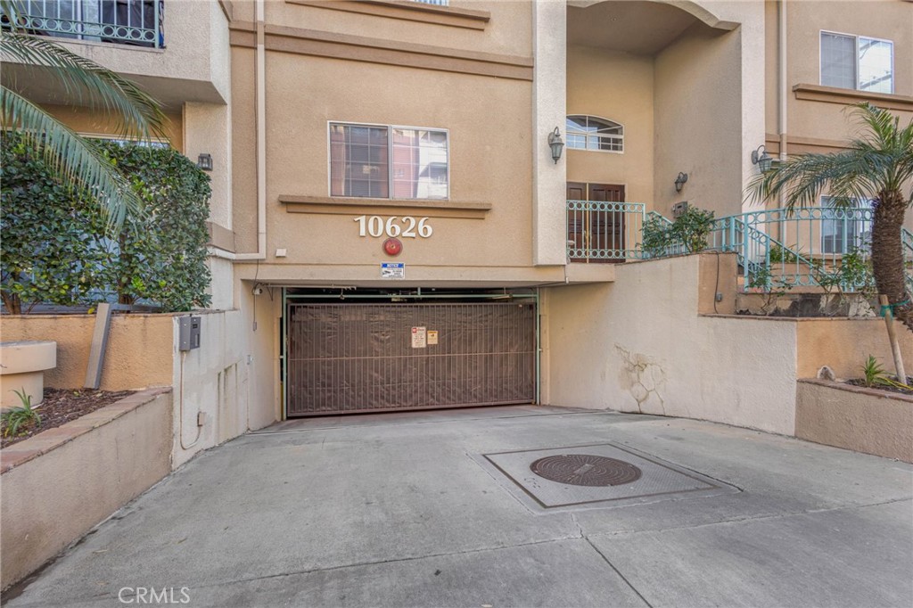 10626 Valley Spring Lane, Unit 103 Toluca Lake, CA 91602 - Photo 42 of 44 a outdoor space with a car parked in front of it