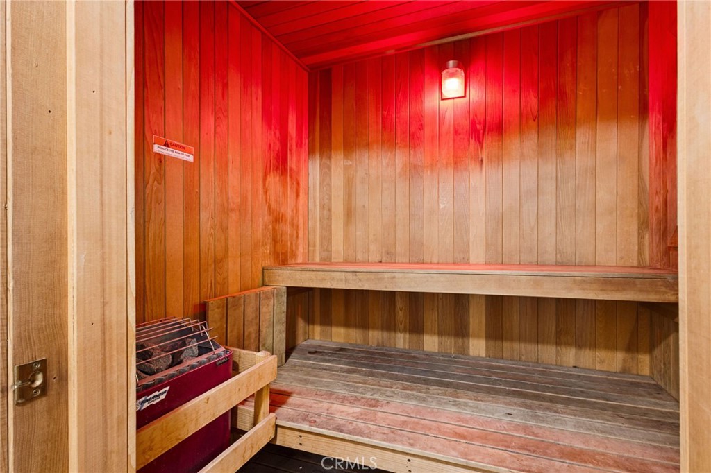 10626 Valley Spring Lane, Unit 103 Toluca Lake, CA 91602 - Photo 57 of 67 a bathroom with a sink and a mirror