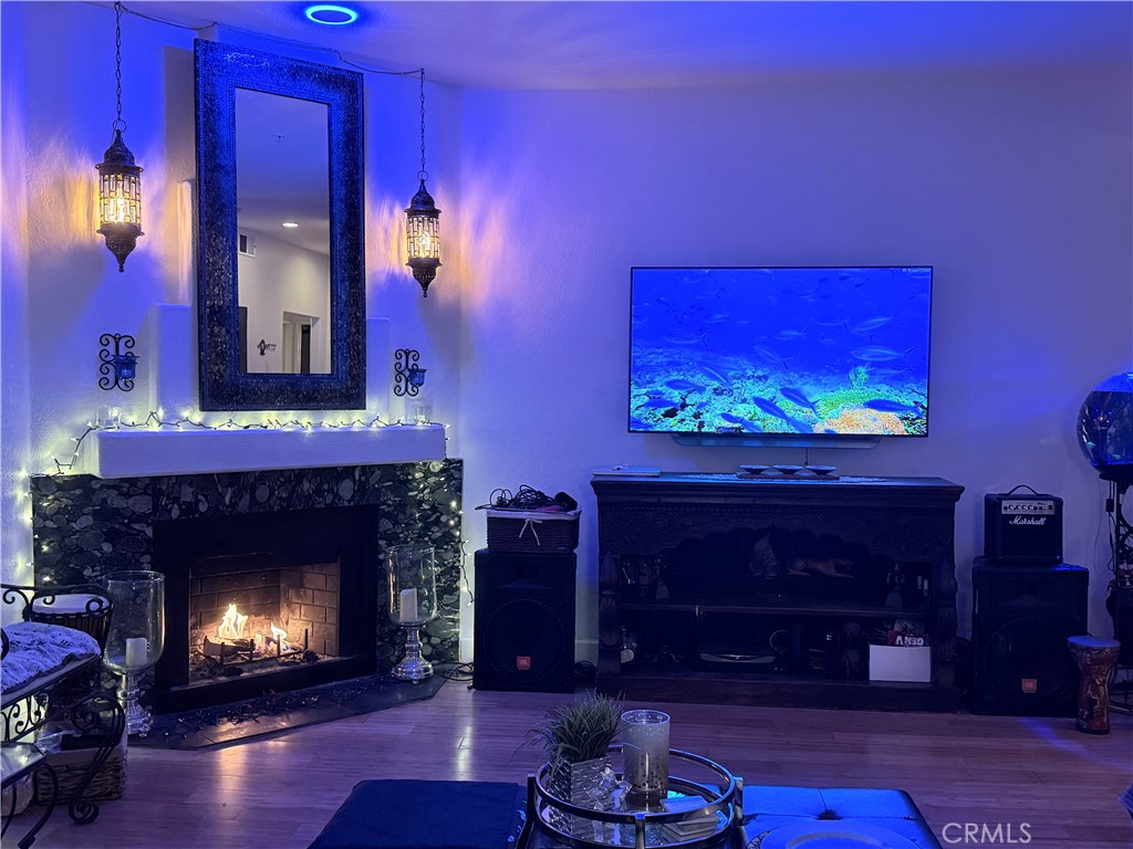 10626 Valley Spring Lane, Unit 103 Toluca Lake, CA 91602 - Photo 7 of 13 a living room with furniture and a fireplace