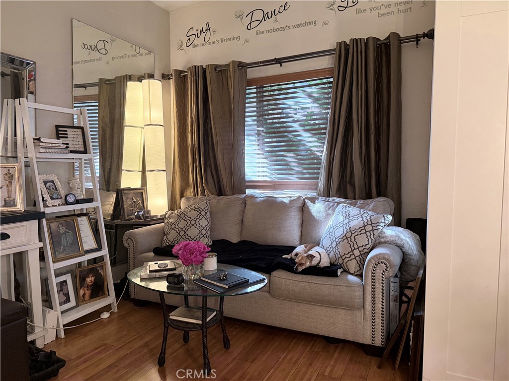 10626 Valley Spring Lane, Unit 103 Toluca Lake, CA 91602 - Photo 10 of 13 a living room with furniture and a window