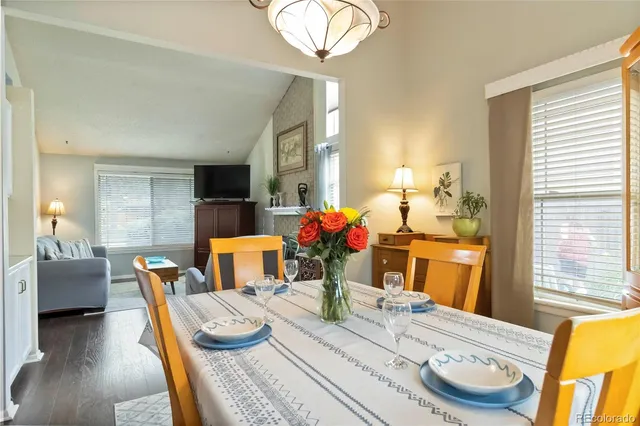 a living room with furniture and a large mirror