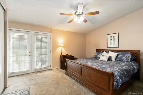 a bedroom with a large bed and a large window