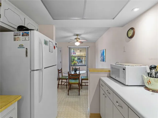 a view of a house with yard and tree s