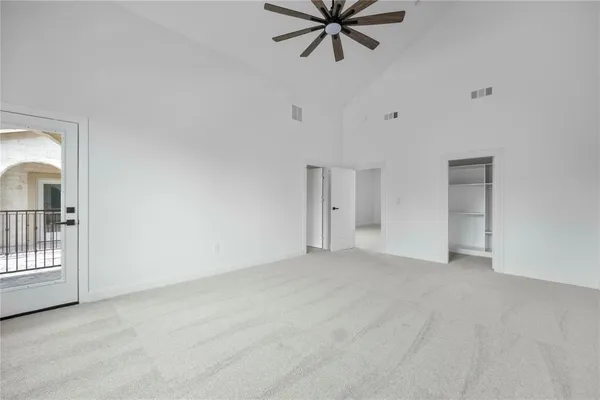 a bathroom with double vanity sinks and a shower
