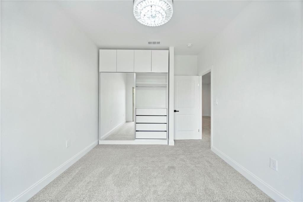 6238 Dewitt Street Sachse, TX 75048 - Photo 15 of 21 a view of a room with rack on the wall