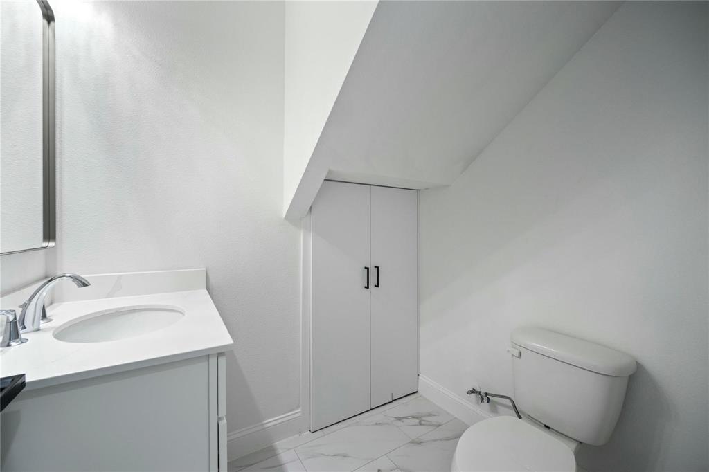 6238 Dewitt Street Sachse, TX 75048 - Photo 7 of 21 a bathroom with a sink toilet and shower