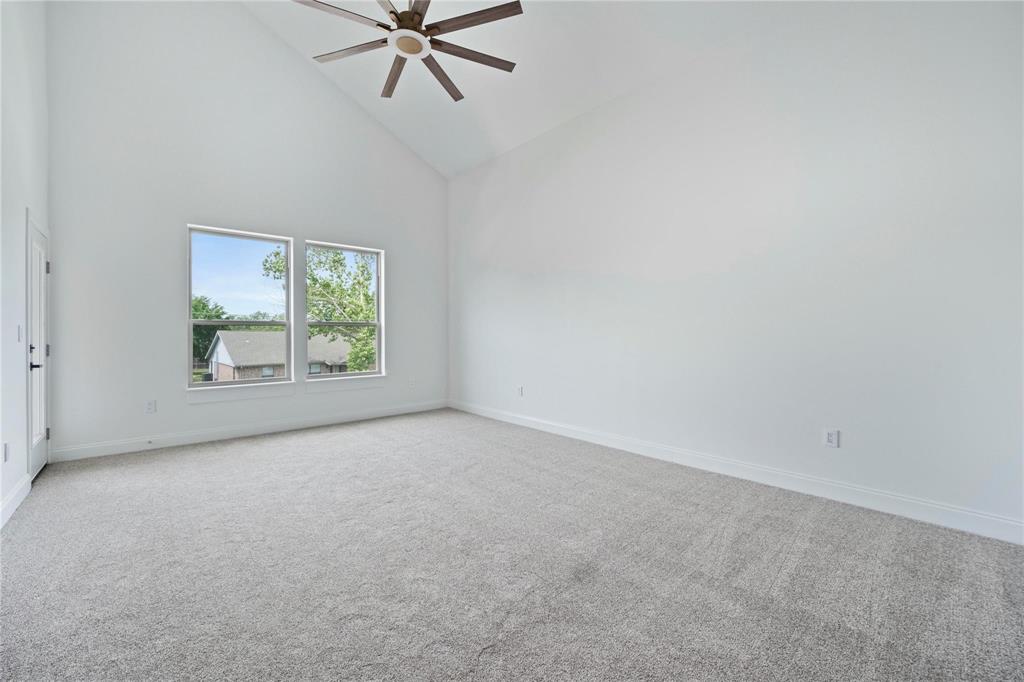 6238 Dewitt Street Sachse, TX 75048 - Photo 10 of 21 an empty room with a window and a fan