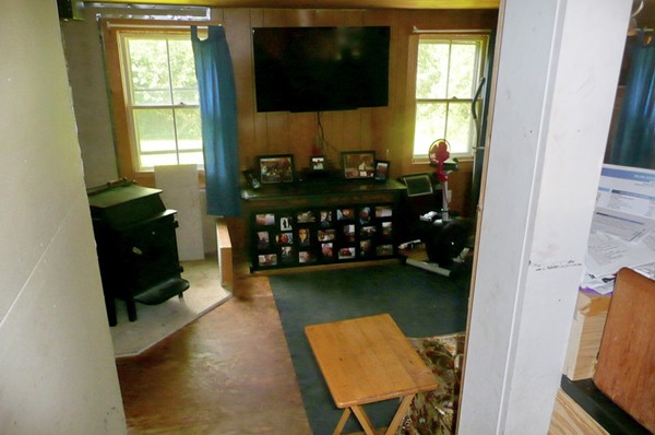 117 Folly Mill Road Salisbury, MA 01952 - Photo 14 of 18 a bedroom with a bed closet and flat tv screen on the dresser