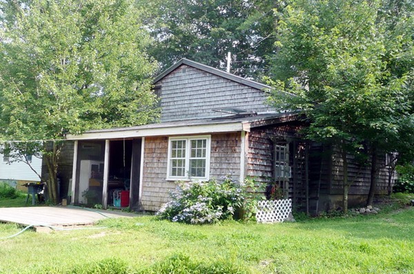 117 Folly Mill Road Salisbury, MA 01952 - Photo 2 of 18 a front view of a house with a yard and tree