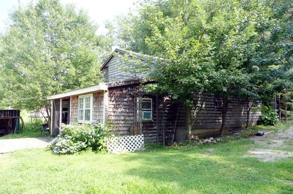 117 Folly Mill Road Salisbury, MA 01952 - Photo 3 of 18 a view of a backyard with plants and large tree