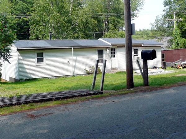 117 Folly Mill Road Salisbury, MA 01952 - Photo 4 of 18 a front view of a house with a yard and garage