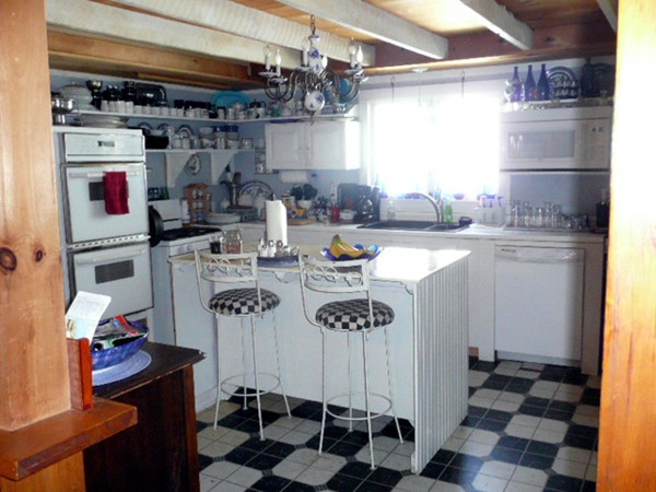 117 Folly Mill Road Salisbury, MA 01952 - Photo 6 of 18 a kitchen with a sink and cabinets