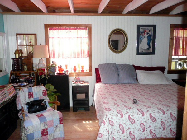 117 Folly Mill Road Salisbury, MA 01952 - Photo 10 of 18 a bedroom with a bed and wooden floor