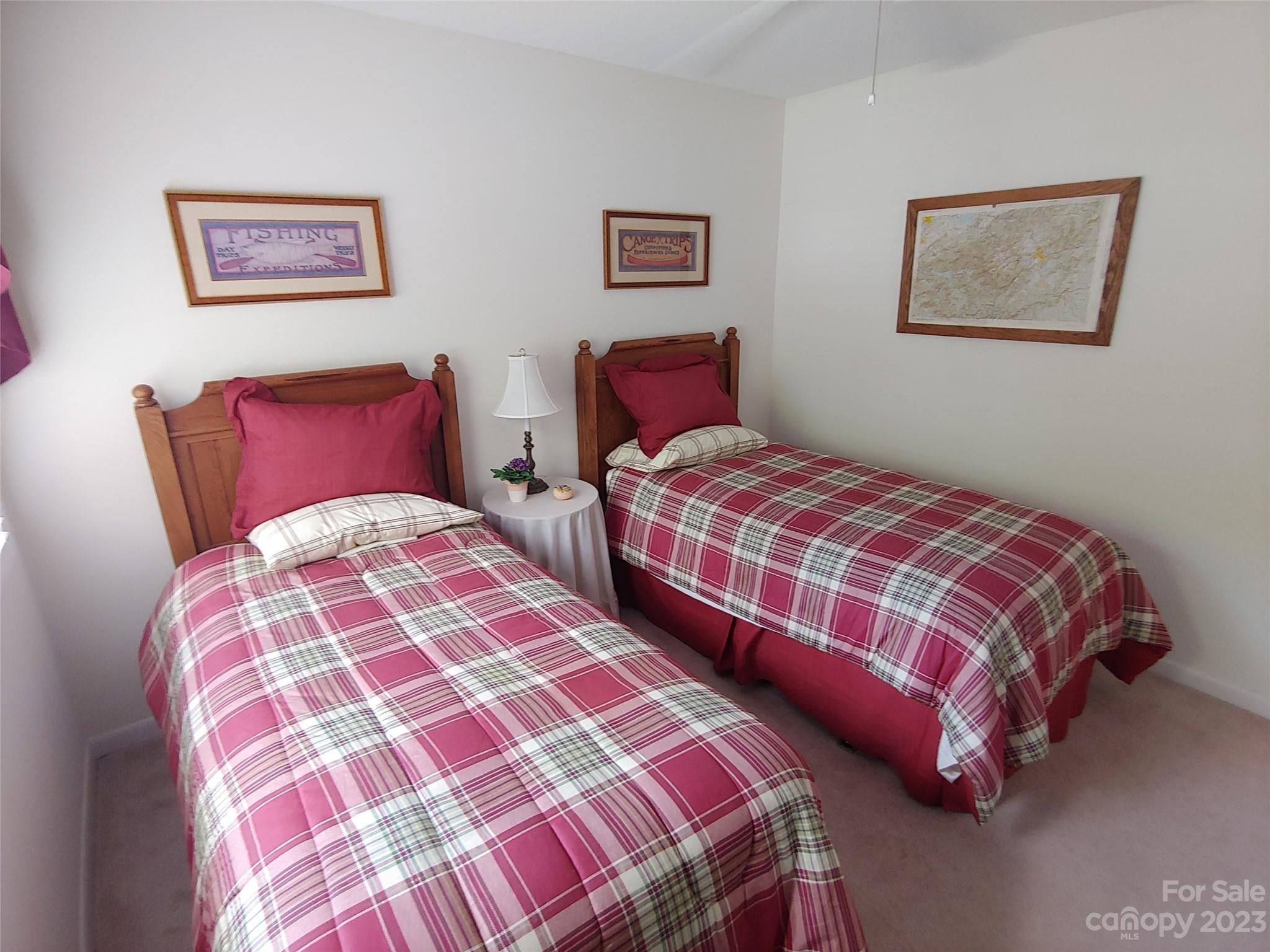 87 Willow Road, Unit D14 Waynesville, NC 28786 - Photo 34 of 47 a bedroom with two bed and a lamp on dresser