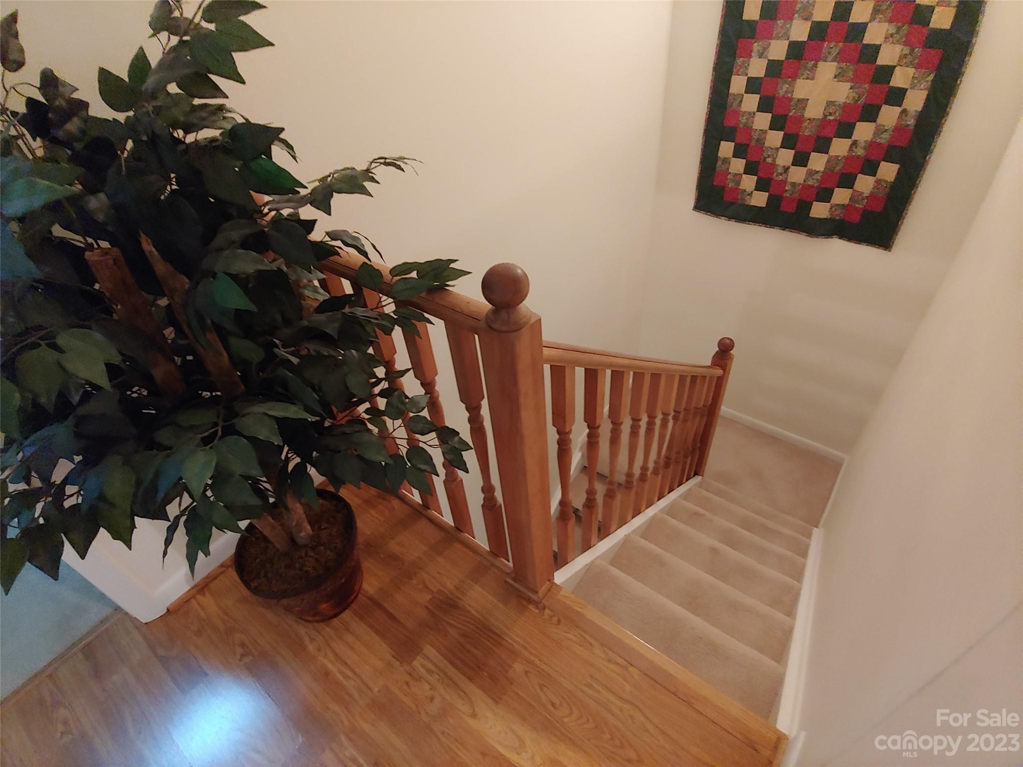 87 Willow Road, Unit D14 Waynesville, NC 28786 - Photo 37 of 47 a view of stairs with wooden floor