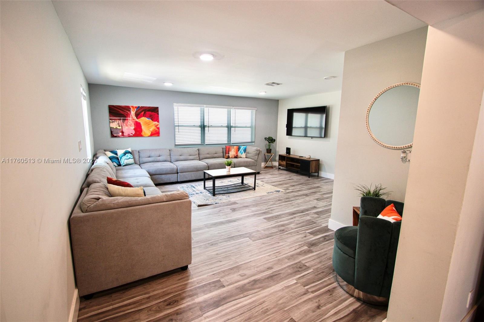 3981 Southwest 58th Street Dania Beach, FL 33312 - Photo 11 of 37 a living room with furniture and a wooden floor