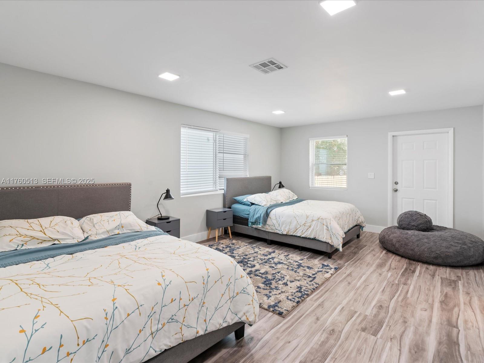 3981 Southwest 58th Street Dania Beach, FL 33312 - Photo 13 of 37 a bedroom with a bed and a dresser