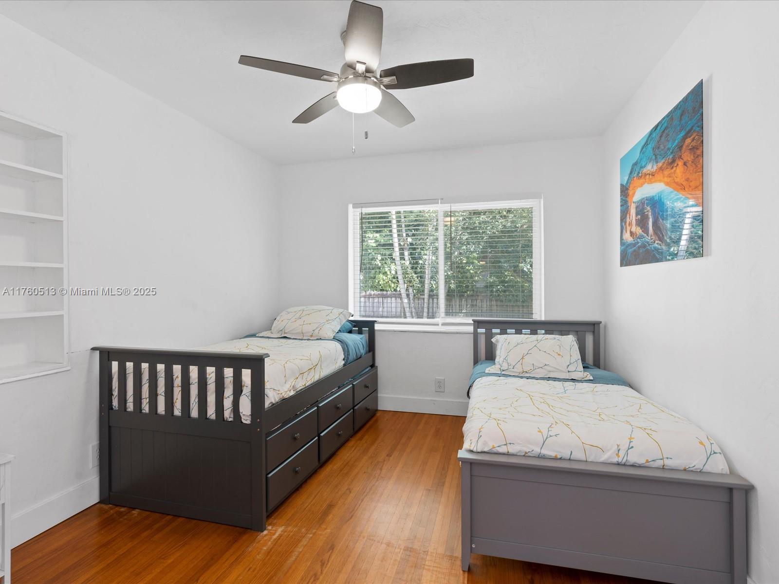 3981 Southwest 58th Street Dania Beach, FL 33312 - Photo 15 of 37 a bed room with a bed and a window