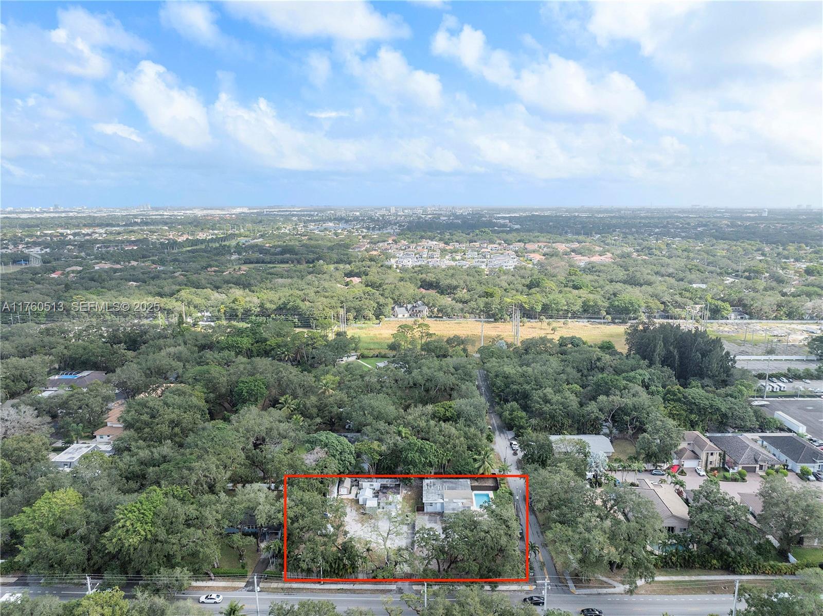 3981 Southwest 58th Street Dania Beach, FL 33312 - Photo 2 of 37 an aerial view of residential building and trees around