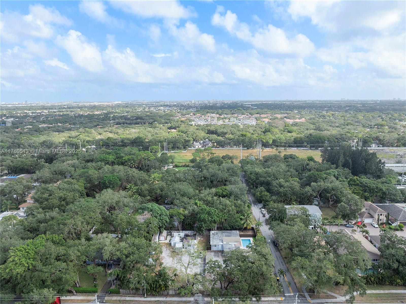 3981 Southwest 58th Street Dania Beach, FL 33312 - Photo 25 of 37 an aerial view of residential house with outdoor space and trees