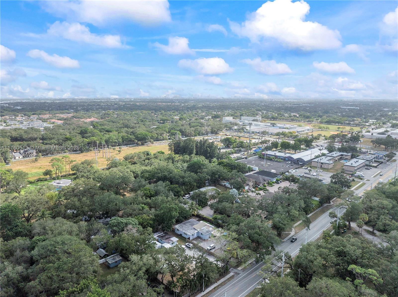 3981 Southwest 58th Street Dania Beach, FL 33312 - Photo 26 of 37 an aerial view of residential houses with outdoor space and trees