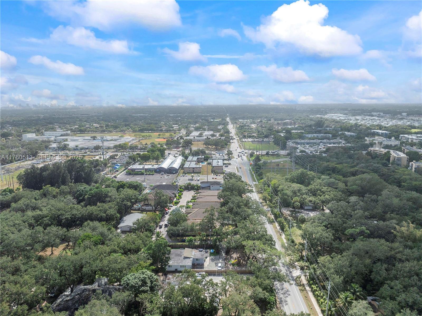 3981 Southwest 58th Street Dania Beach, FL 33312 - Photo 27 of 37 an aerial view of residential building and trees around