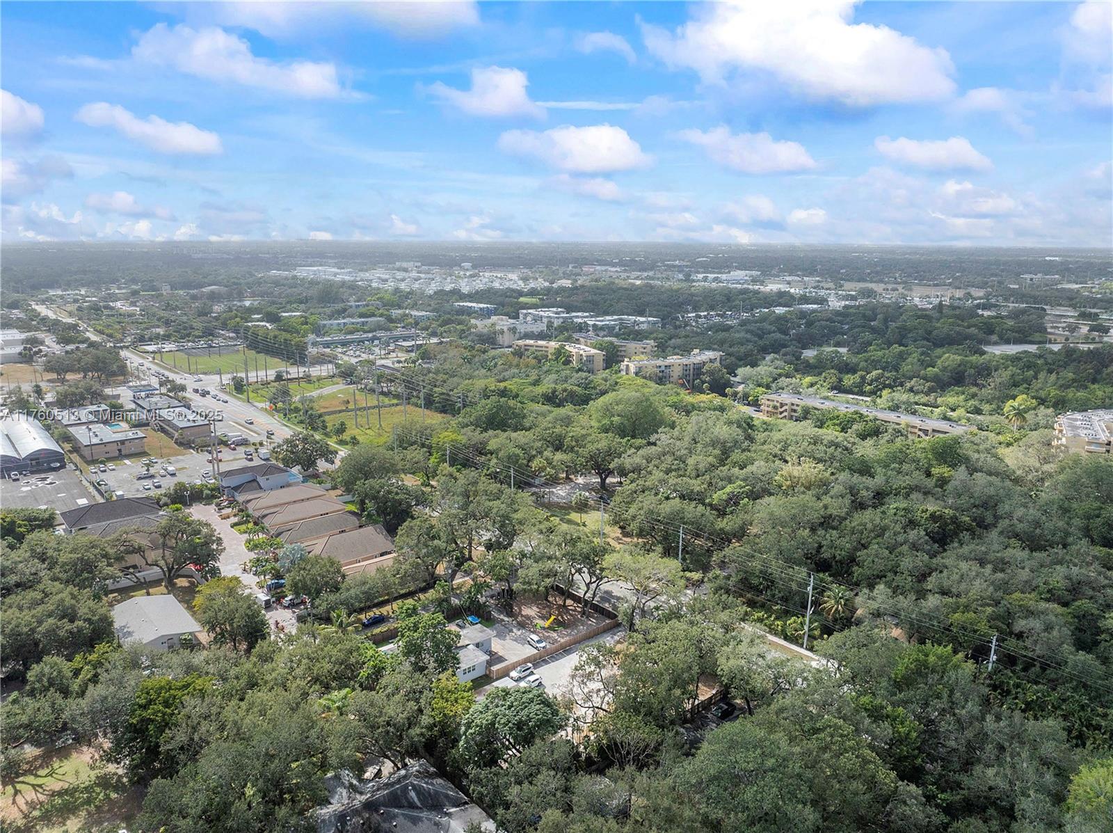 3981 Southwest 58th Street Dania Beach, FL 33312 - Photo 28 of 37 an aerial view of residential houses with outdoor space and trees