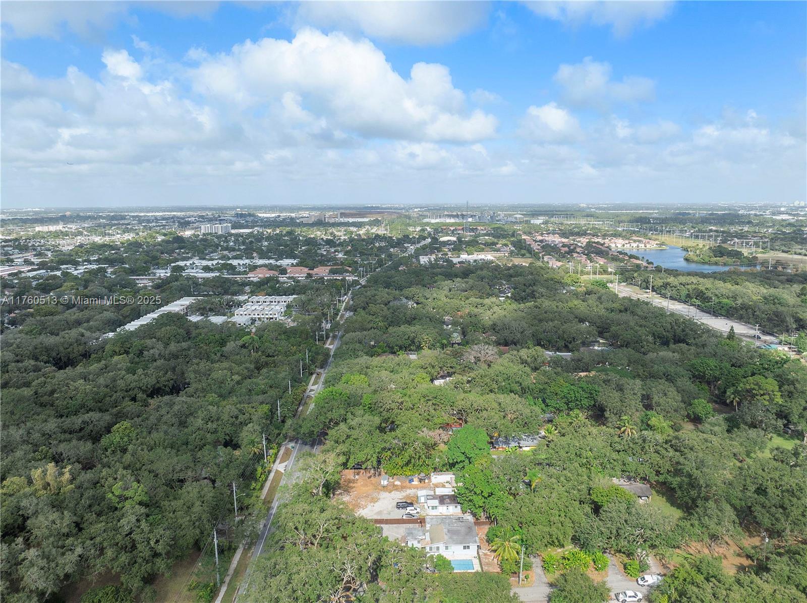 3981 Southwest 58th Street Dania Beach, FL 33312 - Photo 31 of 37 an aerial view of residential houses with outdoor space and trees