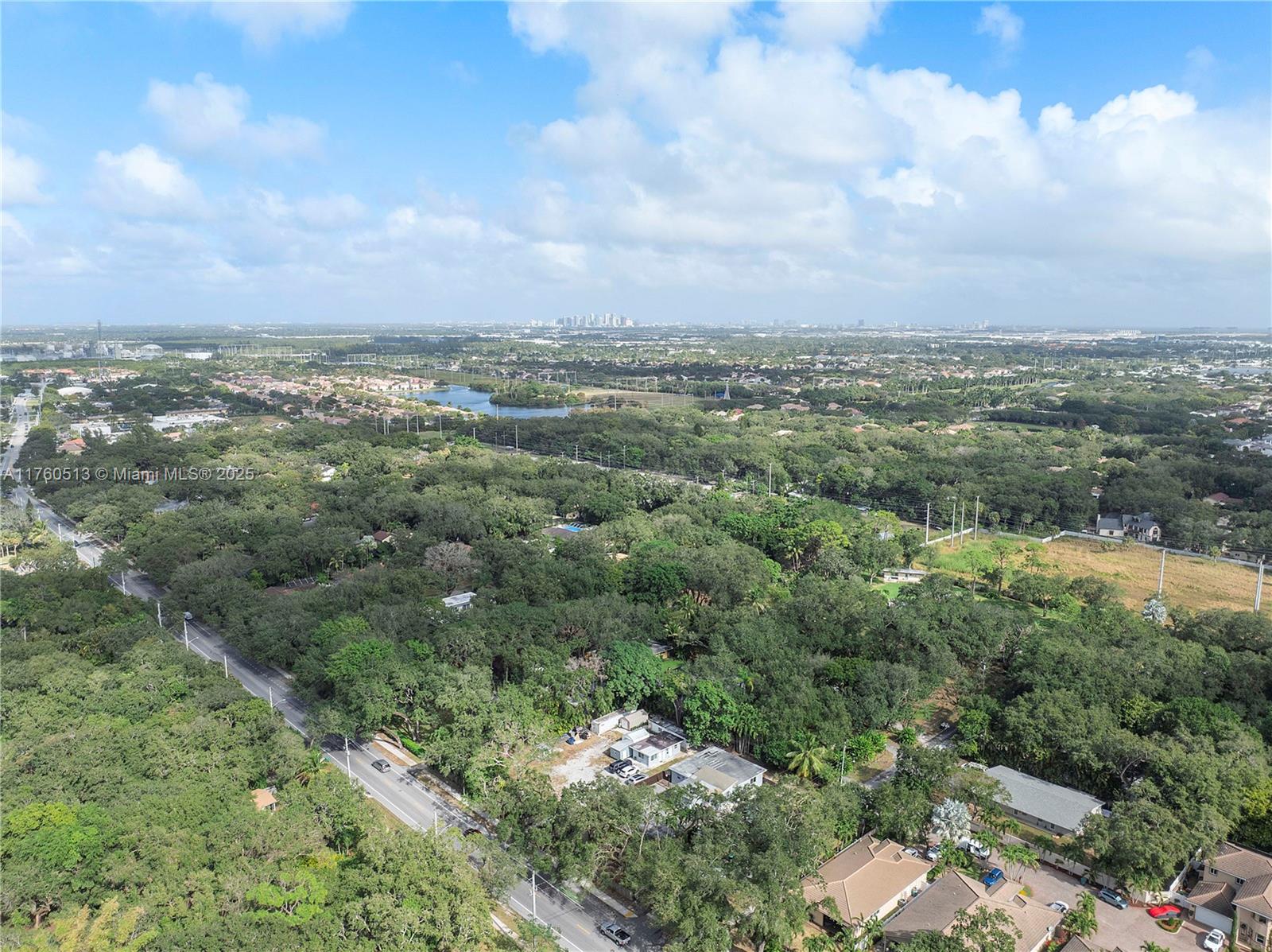 3981 Southwest 58th Street Dania Beach, FL 33312 - Photo 32 of 37 an aerial view of a residential houses with outdoor space and trees
