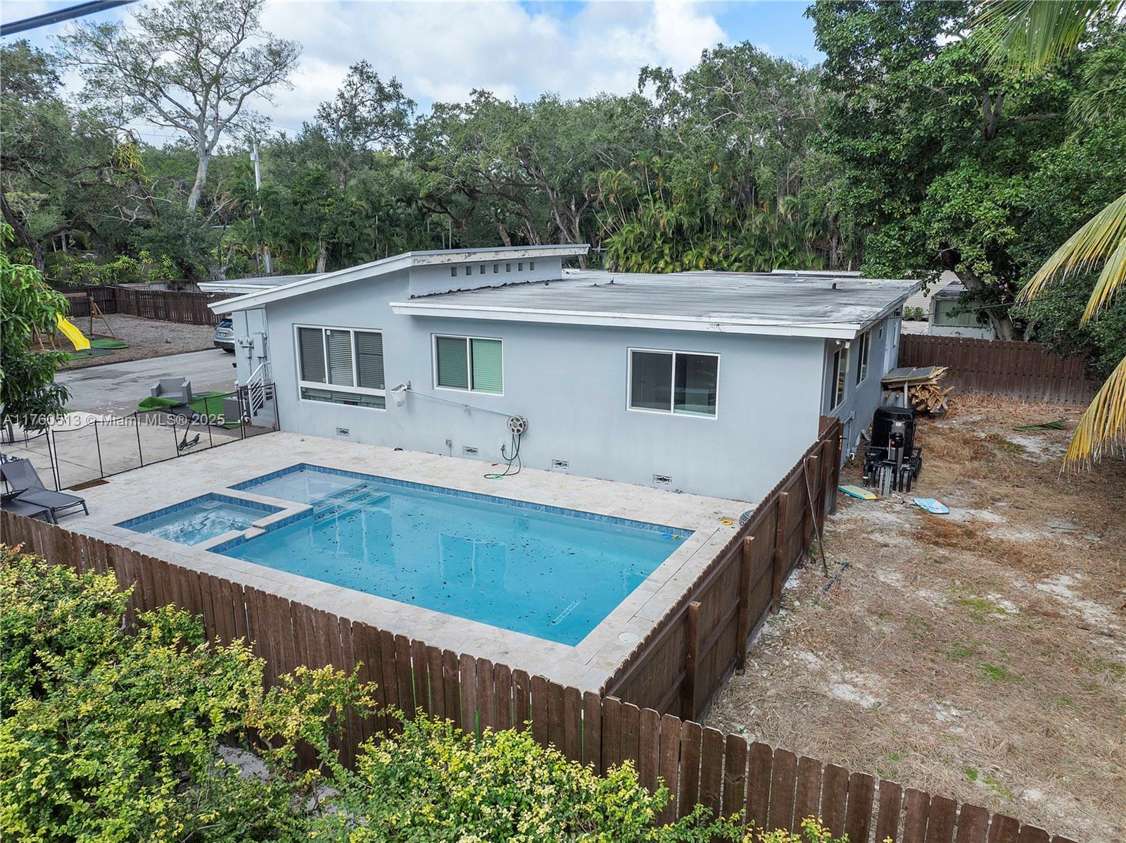 3981 Southwest 58th Street Dania Beach, FL 33312 - Photo 34 of 37 a view of a backyard with a patio