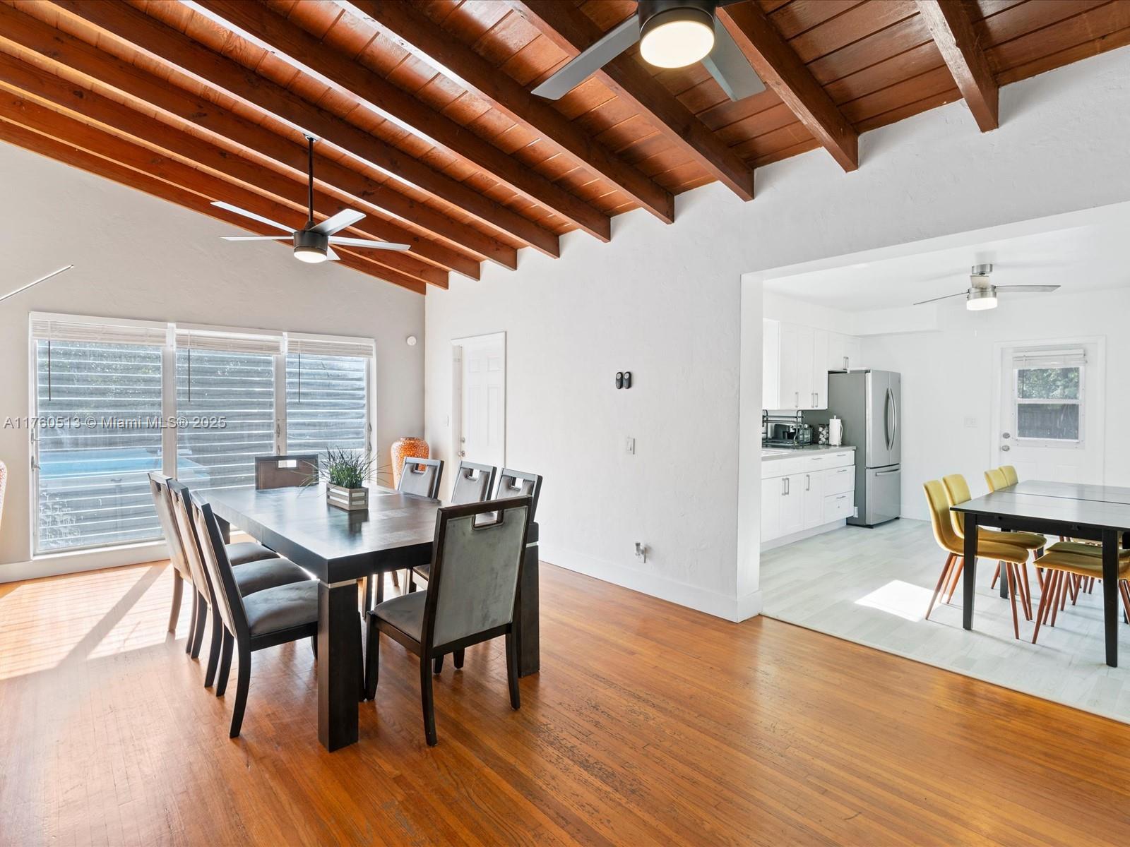 3981 Southwest 58th Street Dania Beach, FL 33312 - Photo 5 of 37 a view of a dining room with furniture and wooden floor